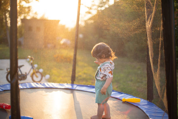 istock Little boy playing on a trampoline 1649134024
