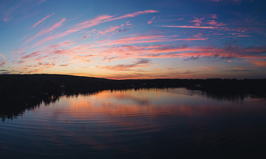 Beautiful sunset reflected in a still lake.