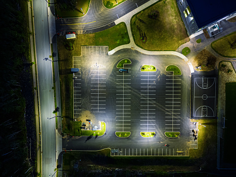 Aerial view of an empty parking lot at night.