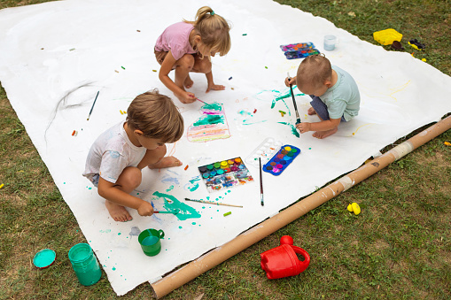 Little kids getting to play with watercolors