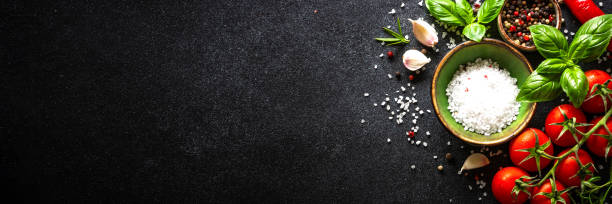 istock Food cooking background on black stone table. 1649170140