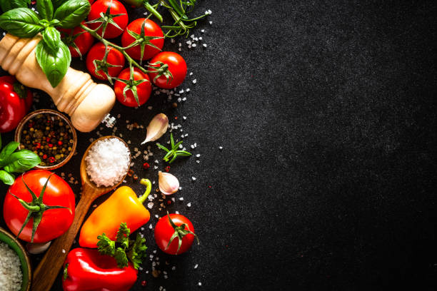 istock Food cooking background on black stone table. 1649170669