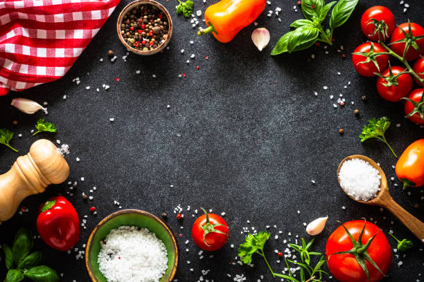 istock Food cooking background on black stone table. 1649170675