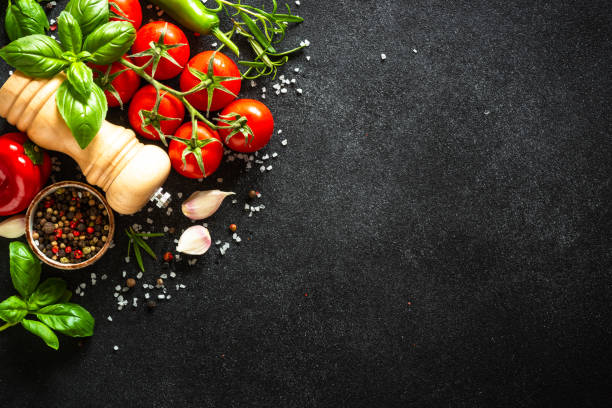 istock Food cooking background on black stone table. 1649171712