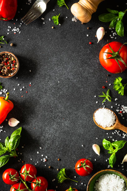 istock Food cooking background on black stone table. 1649171719