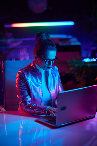 istock modern woman in glasses using laptop in modern office 1649177592