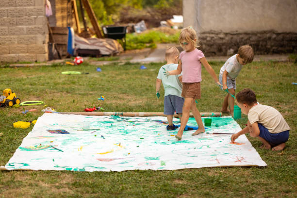 istock Funny kid painting and playing with flippers 1649181874