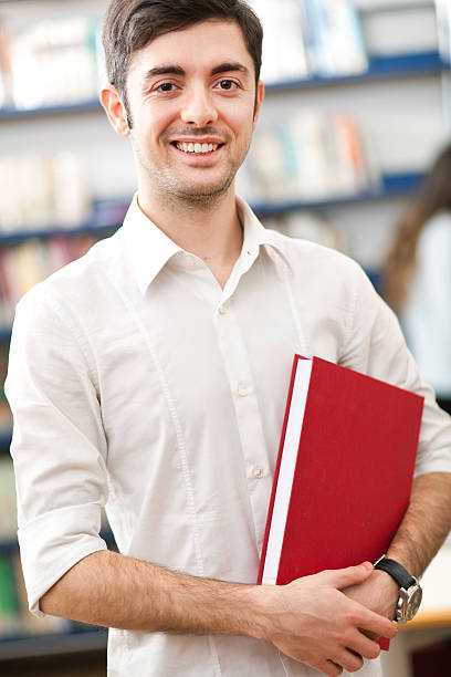 istock Male student in the library 164922504