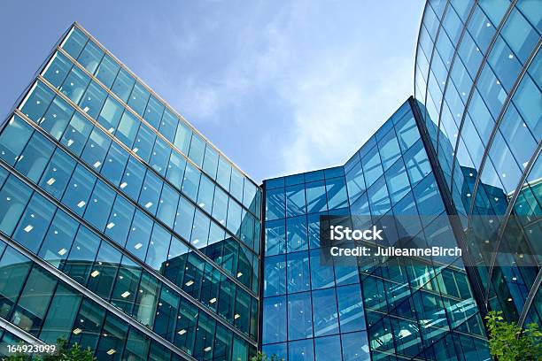 Low Angle View Of The Exterior Of A Corporate Glass Building Stock Photo - Download Image Now