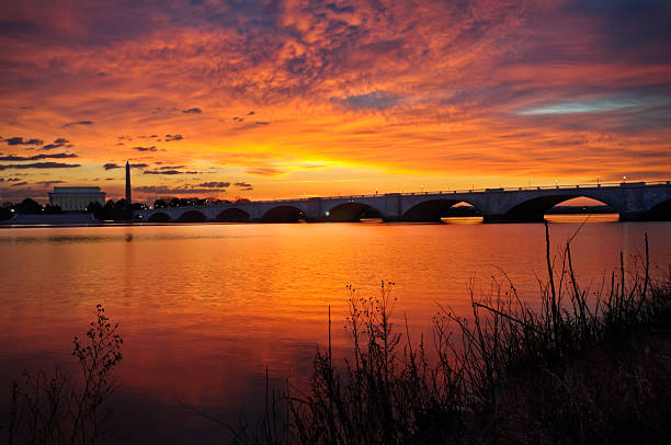 Washington DC Sunrise From the Virginia side of the Potomac river. arlington memorial bridge photos stock pictures, royalty-free photos & images
