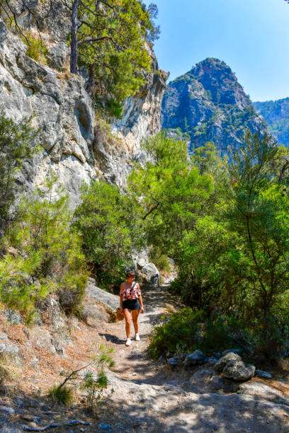 istock Young and cheerful woman walking on the path. 1649241961