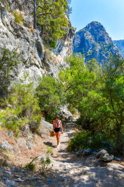 istock Young and cheerful woman walking on the path. 1649243070