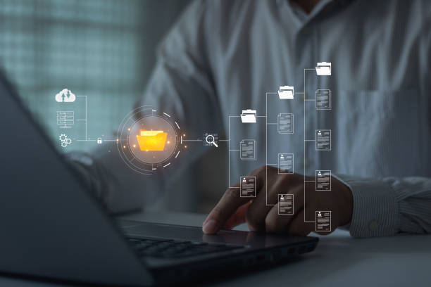 istock Businessmen use laptops to access information in online documents. through the protection system.Document Management System (DMS), online documentation database, and digital file cloud storage system. 1649259523