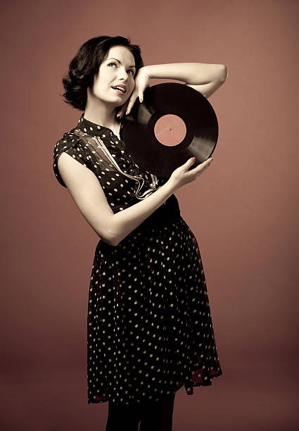 istock Retro portrait with vinyl record 164927350