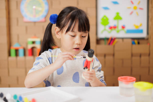 istock young girl was making craft at home 1649273977