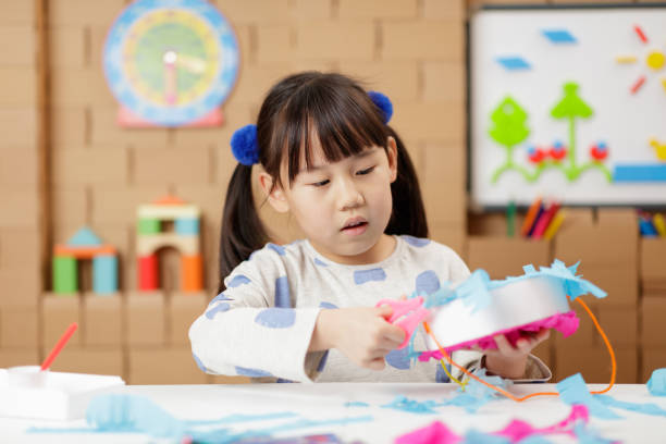 istock young girl was making craft at home 1649273993
