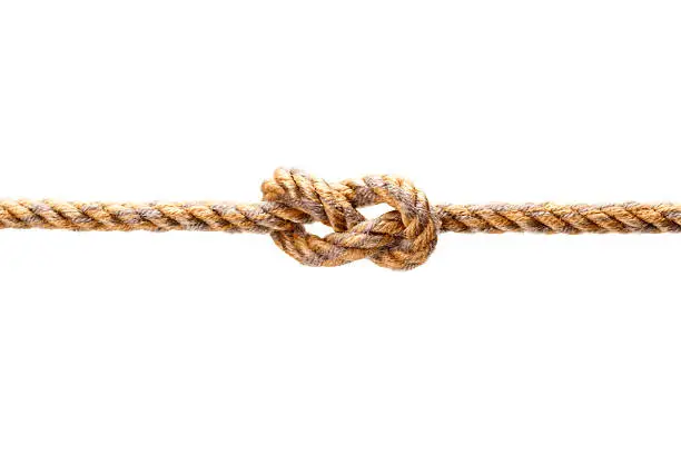 Closeup shot of a rope with a knot, Isolated on white background.
