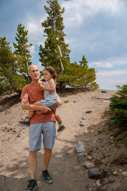 istock Active senior man hiking with his granddaughter 1649297889