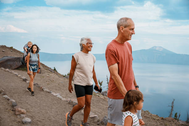 istock Multi-generation family hiking around mountain lake 1649298423