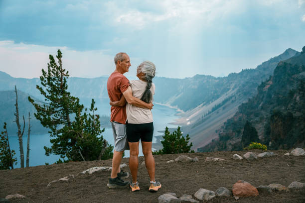 istock Active senior couple enjoying scenic view while on a hike 1649298432