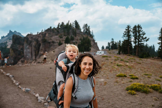 istock Happy baby on a hike with his mom 1649298436
