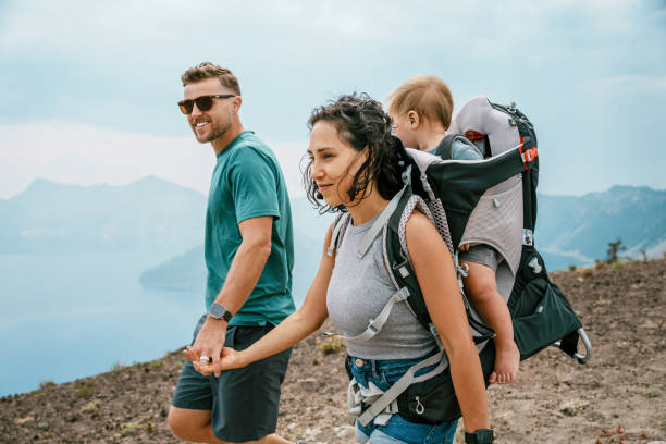 istock Active couple hiking with their baby 1649298474