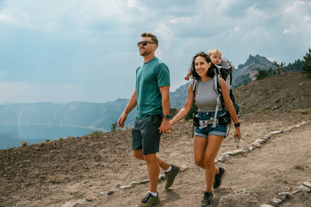 istock Happy family enjoying mountain hike 1649298691