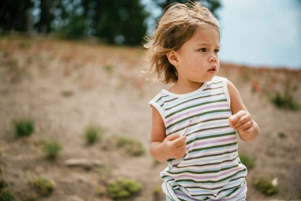 istock Three year old girl outside on hike 1649299024