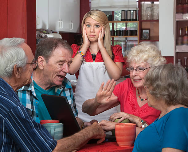 istock Young Waitress and Arguing Seniors 164930475