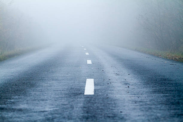 istock Asphalt road in an autumn fog 164932219