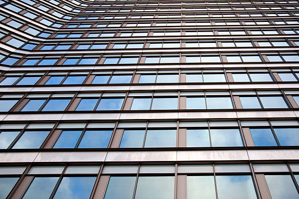 istock facade of office building reflecting white cloud 164932562