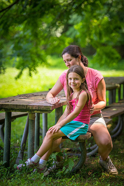 istock Mother and Daughter Picnic Table Portrait 164933209