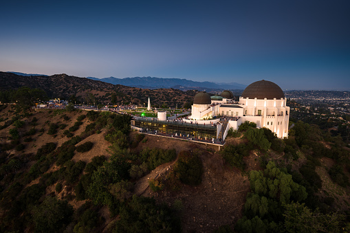 Aerial shot of Griffith Park in Los Angeles, California at twilight.