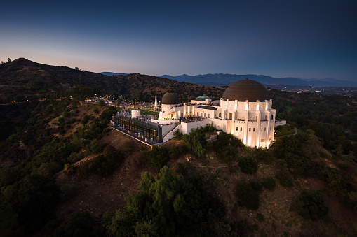 Aerial shot of Griffith Park in Los Angeles, California at twilight.