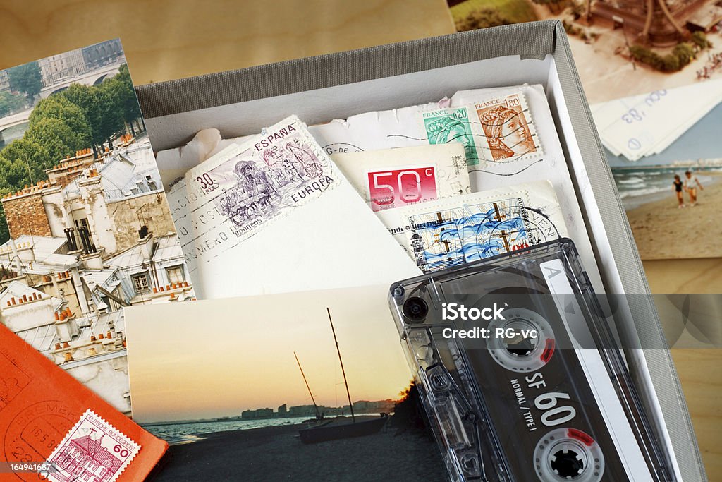 Box filled with memories Box filled with letters and photos. Photos where taken in Paris, and on the beach of the Mediterranean Sea. (Near Agde, France) Nostalgia Stock Photo