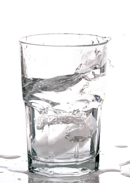 istock Refreshing Splashy Glass of Ice Water 164942340