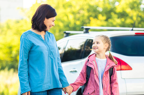 istock Mother with daughter going back to school 1649439733