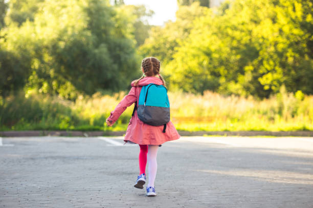 istock School girl running after lessons 1649440778