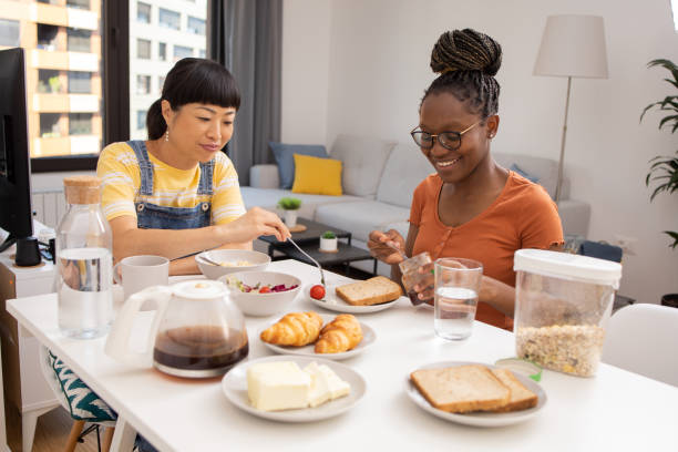 istock Two young women have a meal together 1649442065