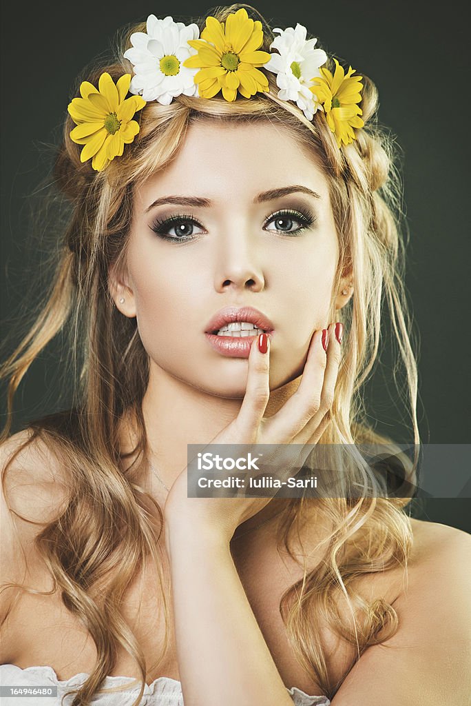 Studio portrait of young woman with the wreath Studio portrait of young woman with the floral wreath Adult Stock Photo