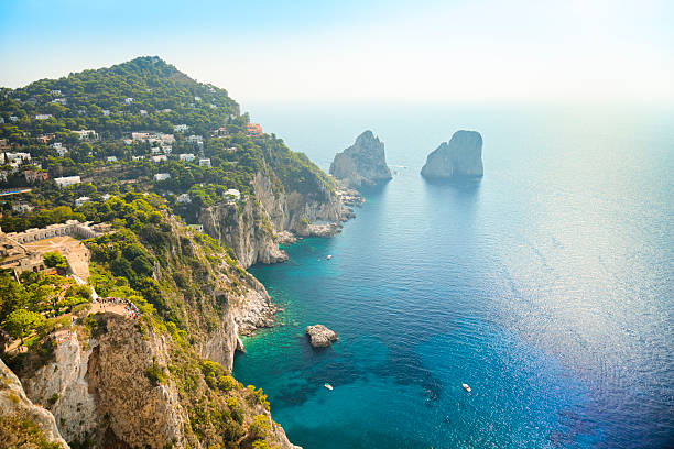 Faraglioni rocks - natural landmark of Capri island in Italy. stock photo