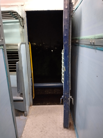 door of a train run by Indian railways at night