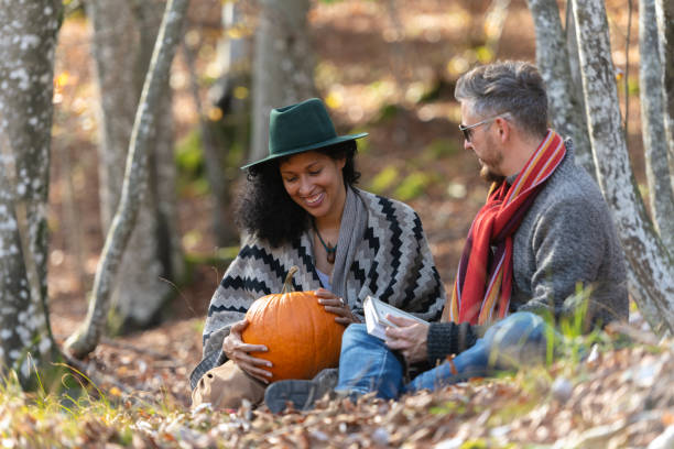 istock Couple sitting in nature. 1649551420