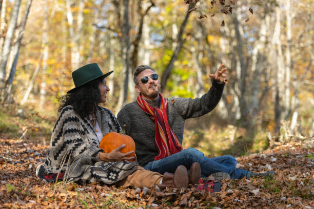 istock Couple sitting in nature. 1649551422