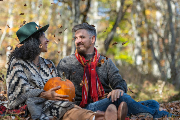 istock Couple sitting in nature. 1649551423