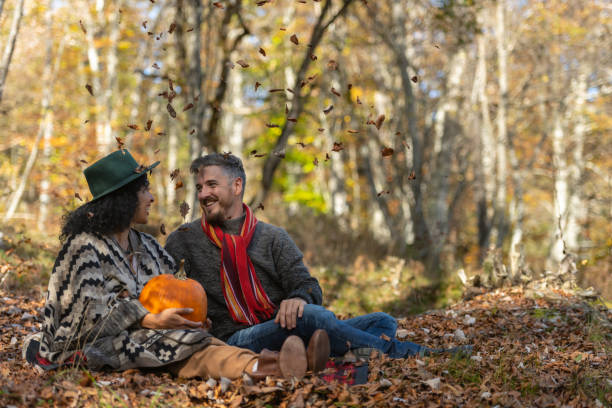 istock Couple sitting in nature. 1649551428
