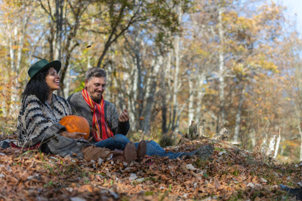 istock Couple sitting in nature. 1649551432