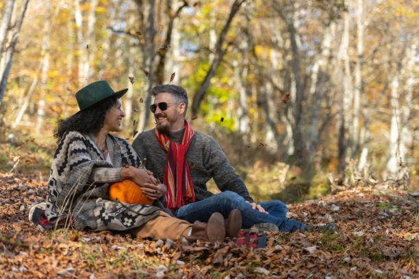 istock Couple sitting in nature. 1649551550