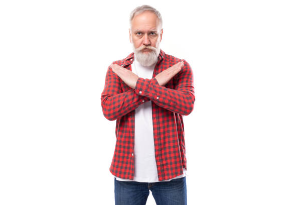 istock handsome 60s retired man with white beard and mustache crossed his arms 1649552112