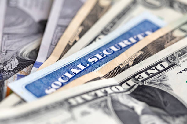 istock Social security card with money 1649618094
